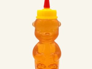 Honigbär Quetschflasche mit Bio-Sommerblütenhonig, gelber Deckel und roter Dosierspitze