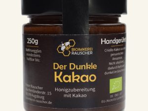 Der Dunkle Kakao von Bioimkerei Rauscher: Bio-Honigzubereitung mit Kakao im 250-g-Glas, Vorderseite des Etiketts