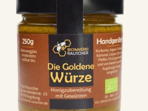 Die Goldene Würze von Bioimkerei Rauscher: Bio-Honigzubereitung mit Gewürzen im 250-g-Glas, Vorderseite des Etiketts