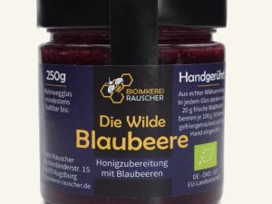 Die Wilde Blaubeere von Bioimkerei Rauscher: Bio-Honigzubereitung mit Blaubeeren im 250-g-Glas, Vorderseite des Etiketts